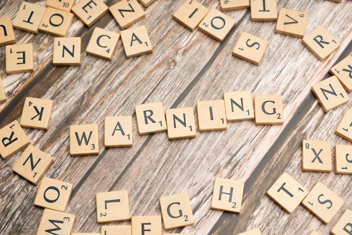Fraud warning displayed on a mobile banking app interface during a theft insurance claim submission
